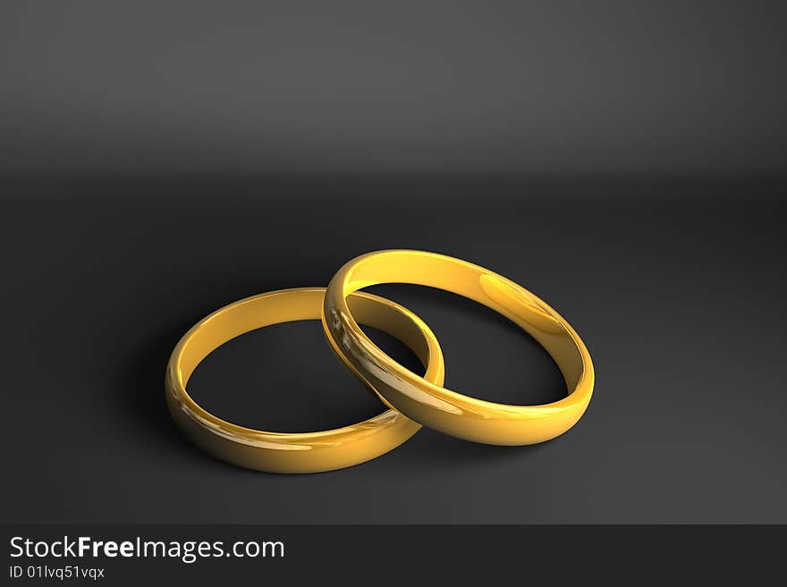 Two golden rings on dark gray background