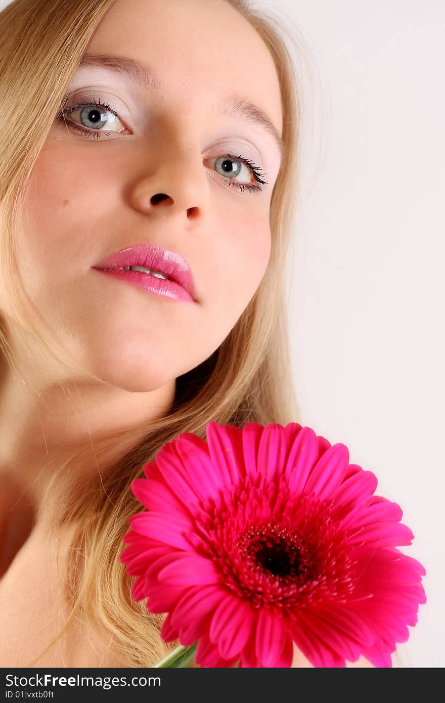 Girl's face and pink flower. Girl's face and pink flower