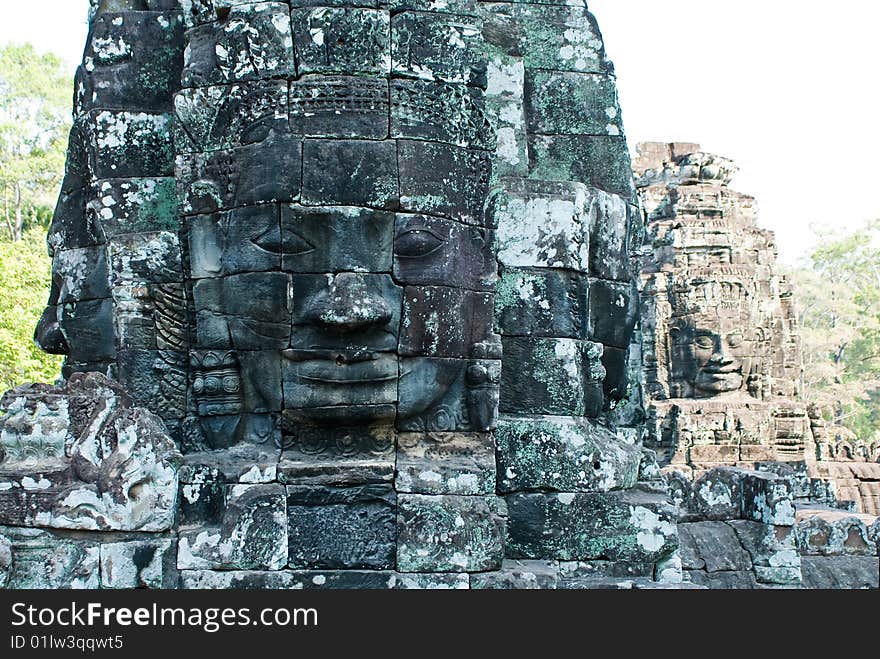 Stone faces on towers of Bayon temple in Angkor Thom, Cambodia. Stone faces on towers of Bayon temple in Angkor Thom, Cambodia