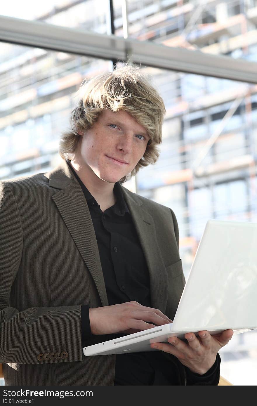 Jung man standing with laptop, man working with laptop,. Jung man standing with laptop, man working with laptop,