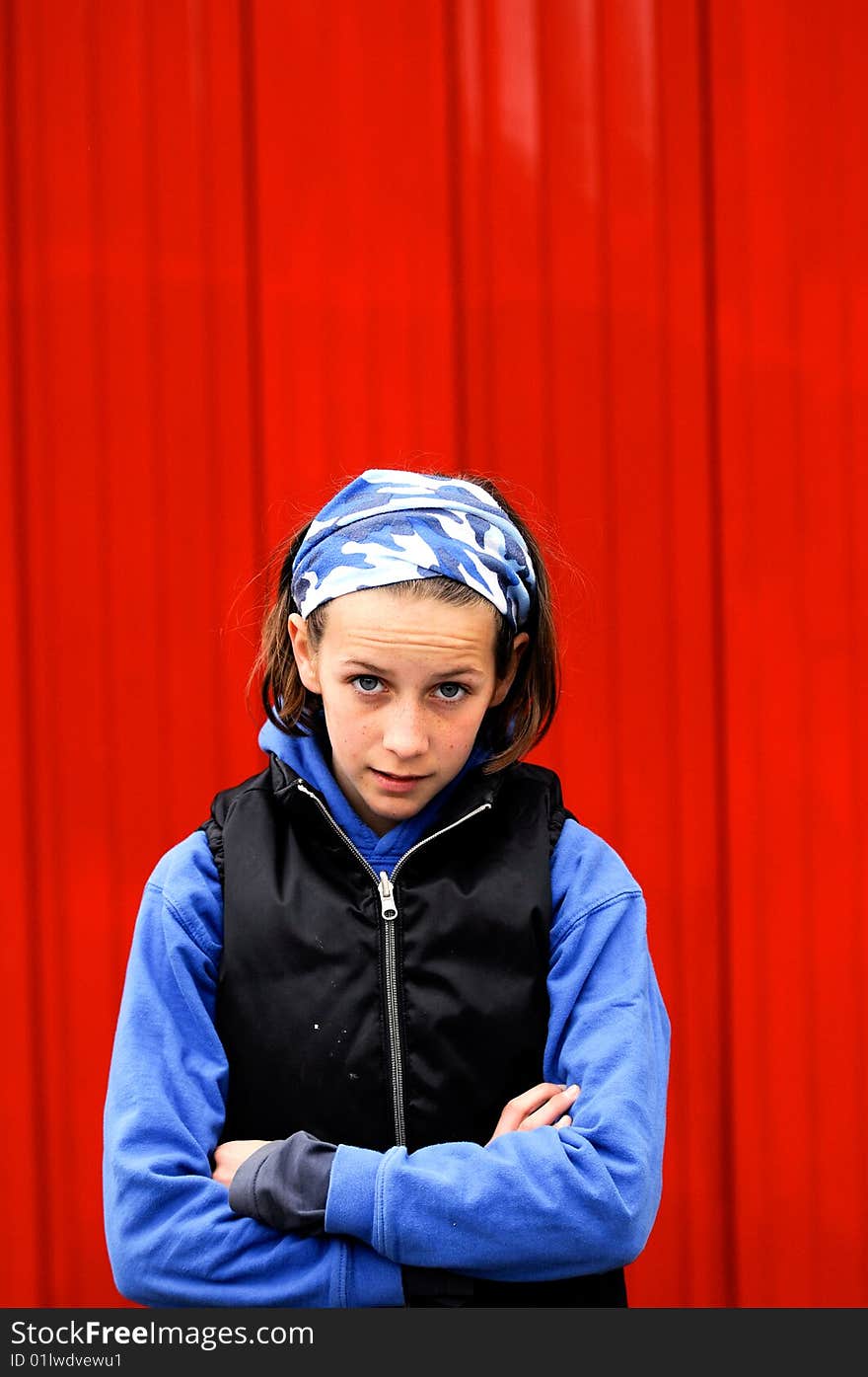 Teenager against red wall