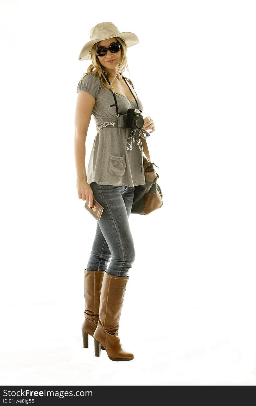 Happy woman going on vacation with passport and her suitcase over a white background