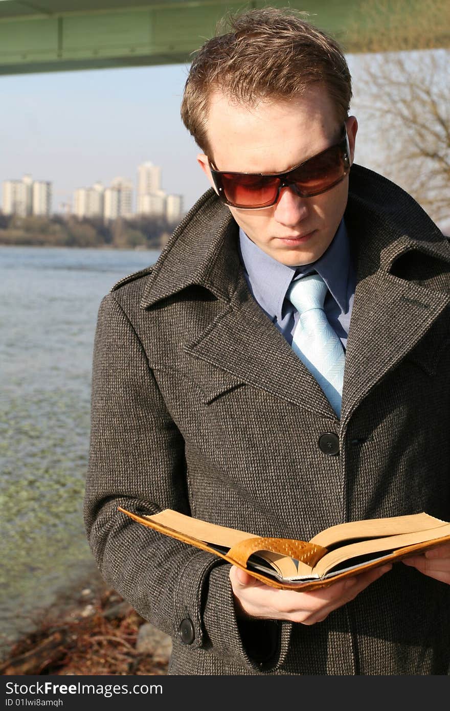 Businessman reading book