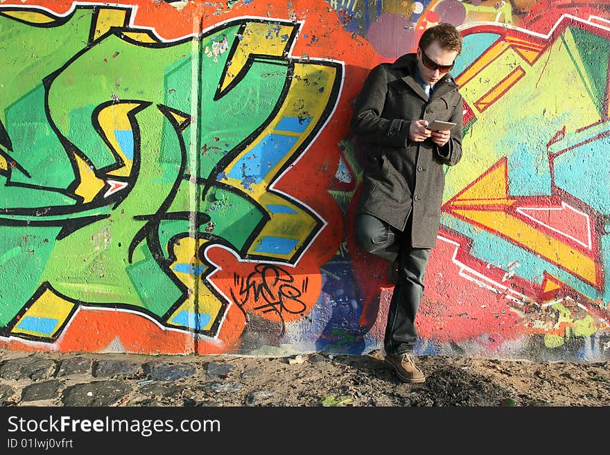 Man working with his pager outdoor. Man working with his pager outdoor