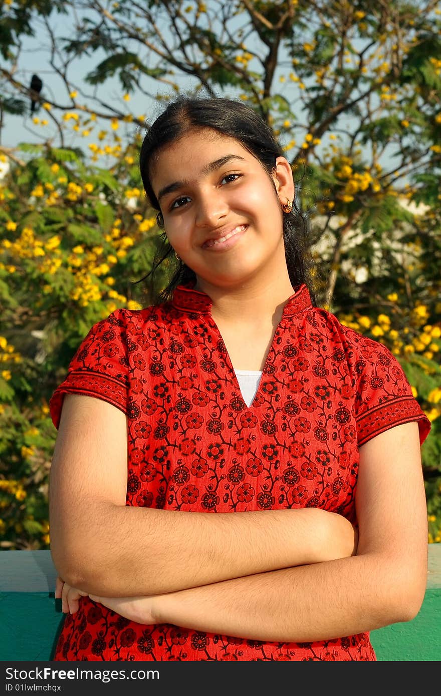 A young Indian girl with an innocent face and energetic smile. A young Indian girl with an innocent face and energetic smile.