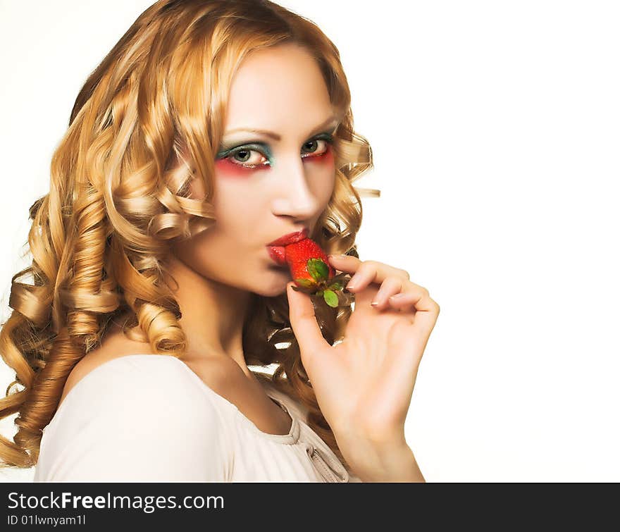 Portrait of pretty blonde with strawberry