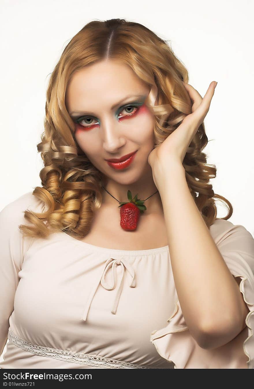 Portrait of pretty blonde with strawberry