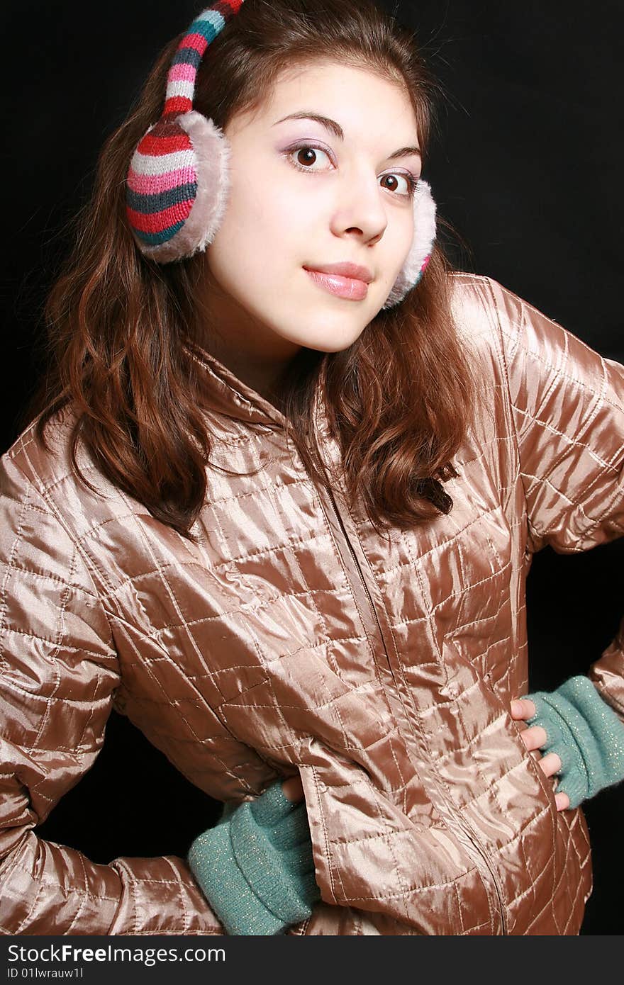 Portrait of the young girl in striped headphones gesticulating hands. Portrait of the young girl in striped headphones gesticulating hands.