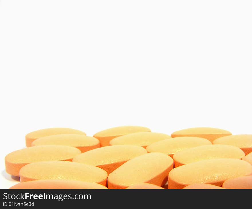 Multiple scattering pills oval pink on a white background. Multiple scattering pills oval pink on a white background