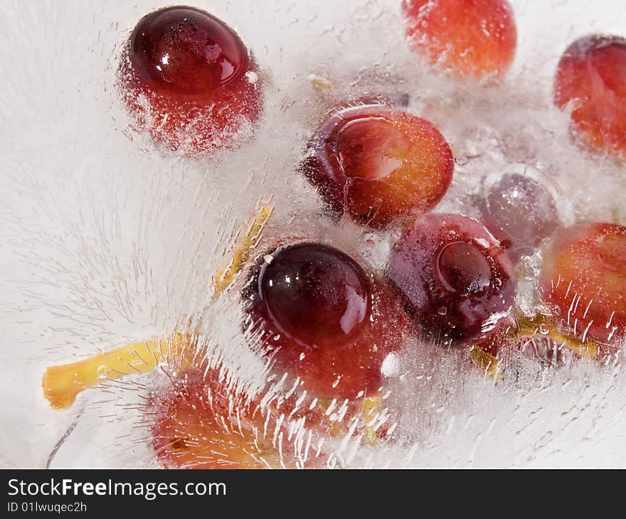 Grape fruit frozen in a ice block. Grape fruit frozen in a ice block