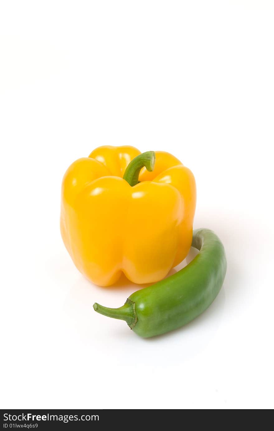 Yellow bell pepper with green Anaheim pepper. Yellow bell pepper with green Anaheim pepper