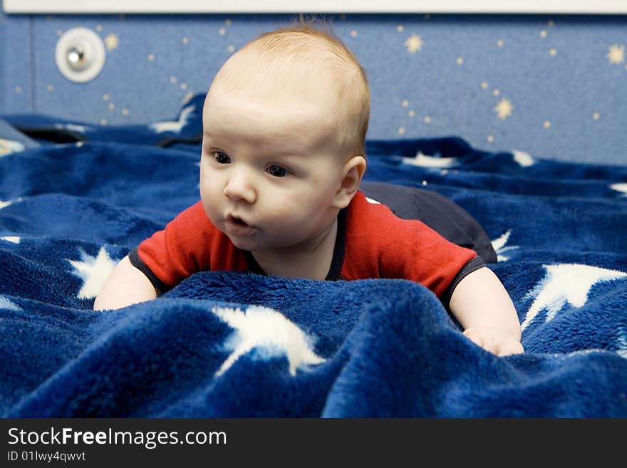 Beautiful little baby portrait on blue background. Beautiful little baby portrait on blue background