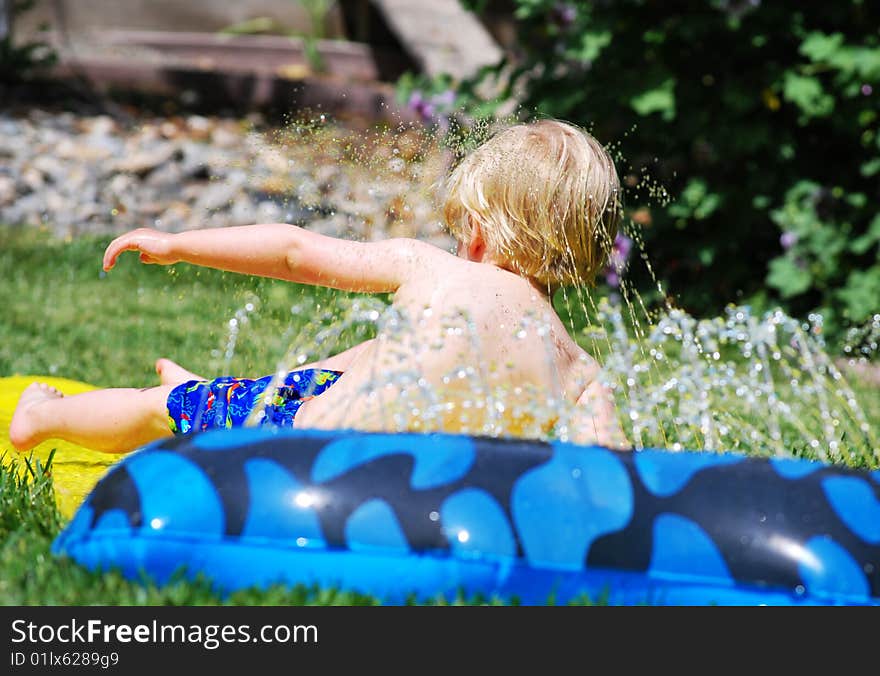 Small Boy Playing Water Games