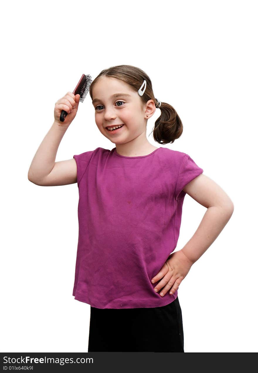 Cute seven years girl with pigtails brush her hair on white background. Cute seven years girl with pigtails brush her hair on white background