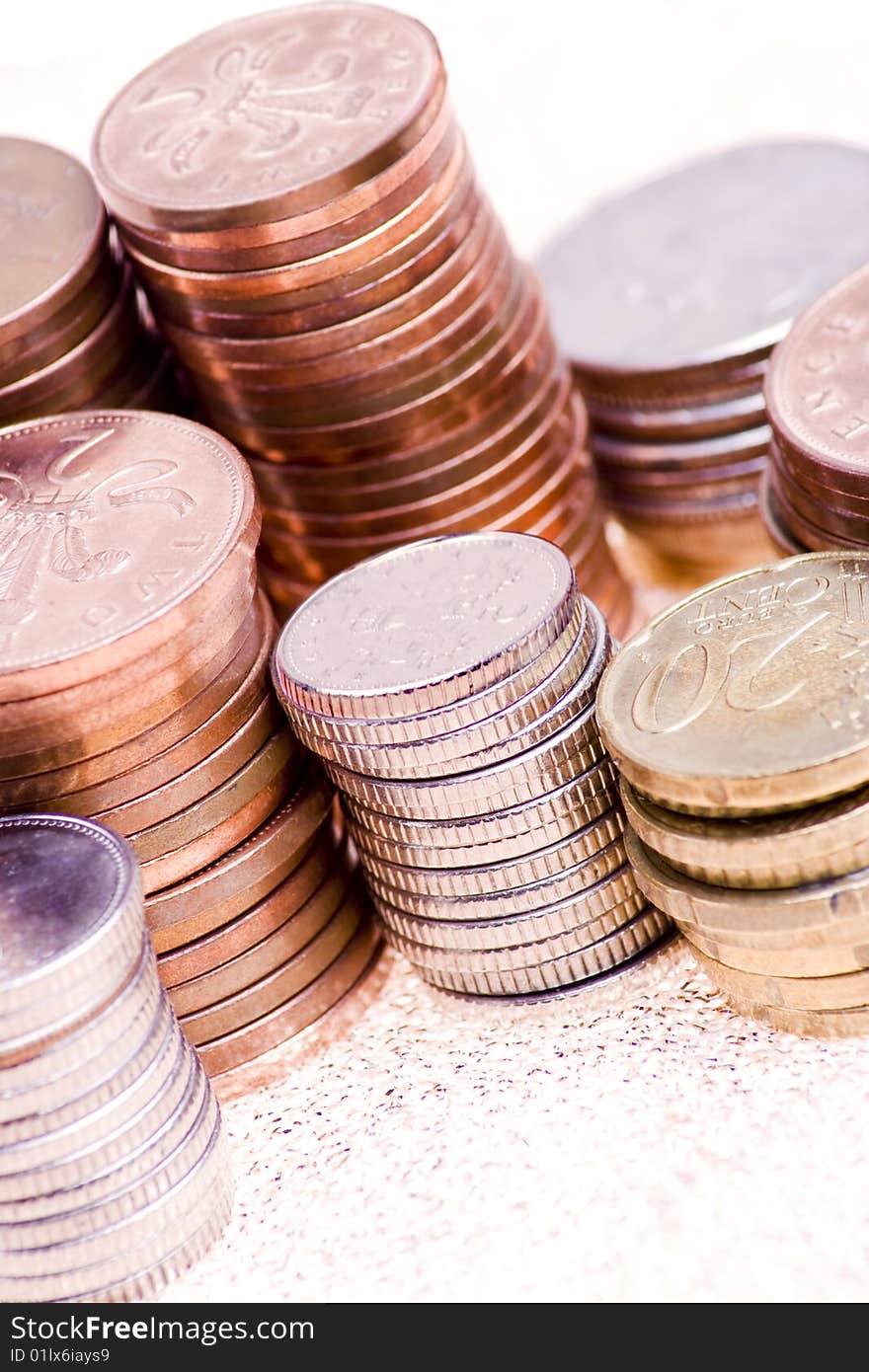 Various piles of silver and copper coins. Various piles of silver and copper coins