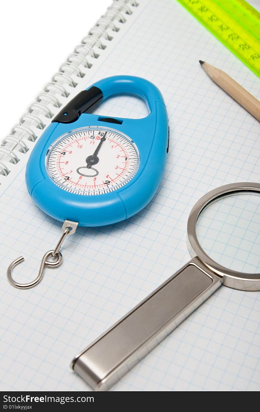 Steelyard, magnifier, pencil and ruler isolated on the white. Steelyard, magnifier, pencil and ruler isolated on the white