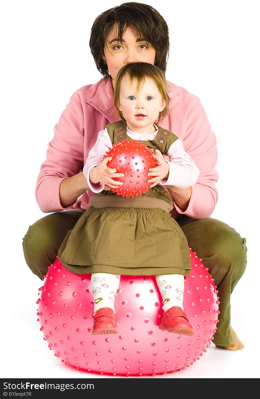 Mother hold daughter on Fitness Ball. Mother hold daughter on Fitness Ball