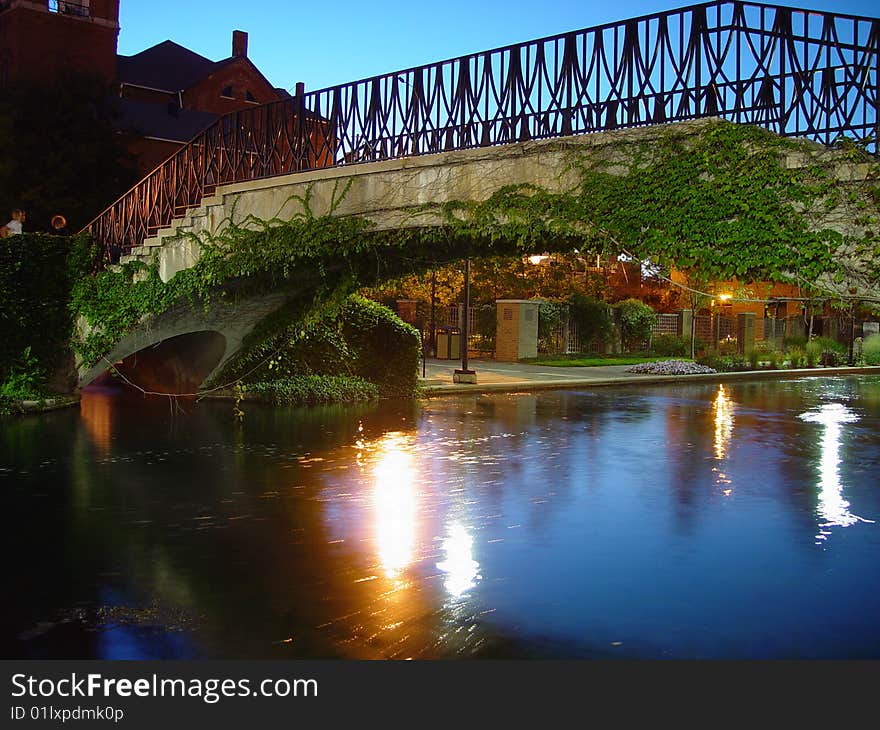 A bridge spanning a canal in the evening. A bridge spanning a canal in the evening.