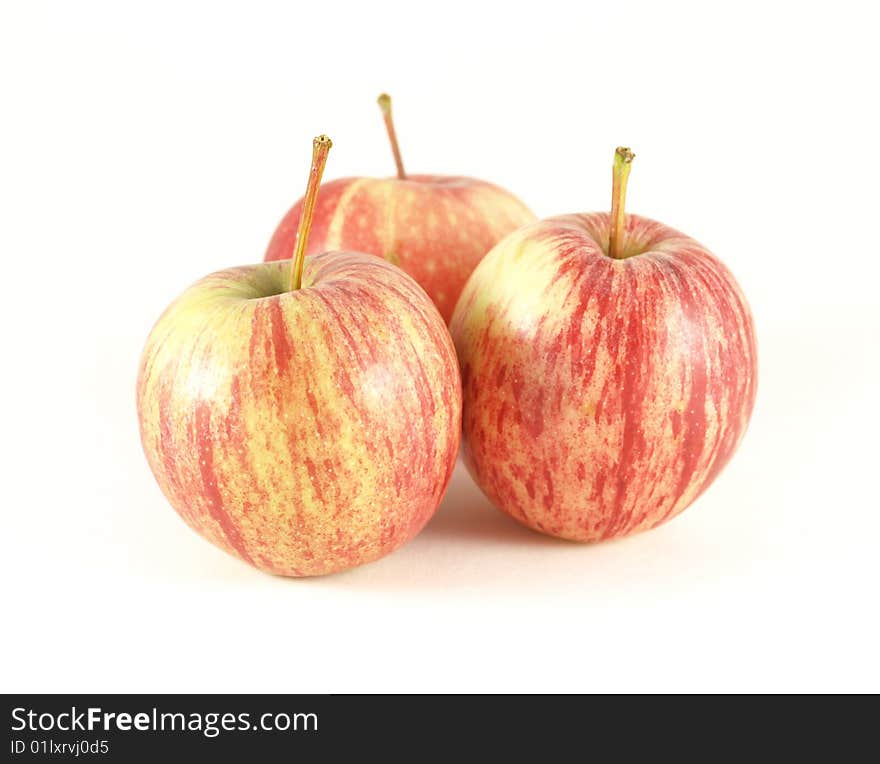 Red and yellow apples on white isolated background.