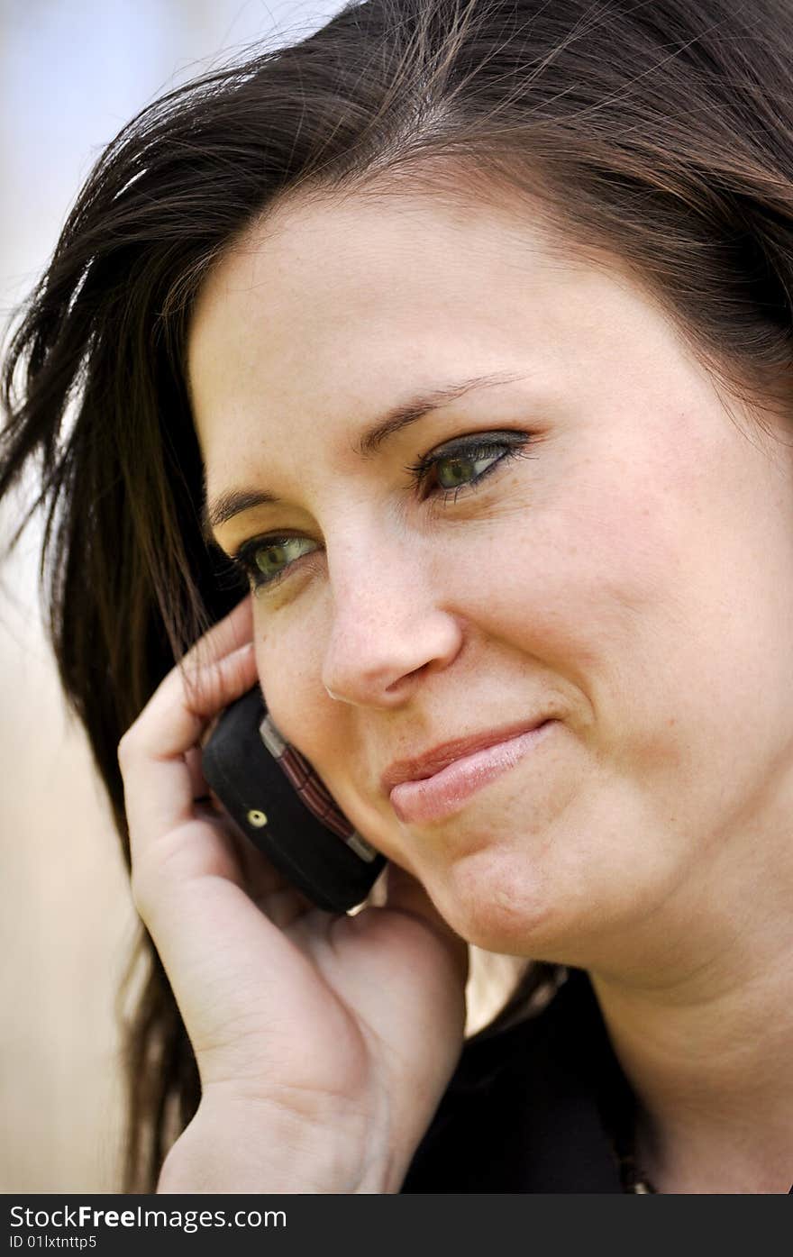 Beautiful business woman laughing on cell phone. Beautiful business woman laughing on cell phone