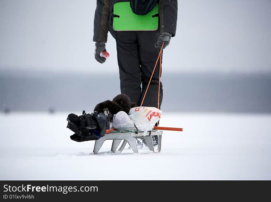 Photo outgoing person with sled and deposit. Photo outgoing person with sled and deposit.