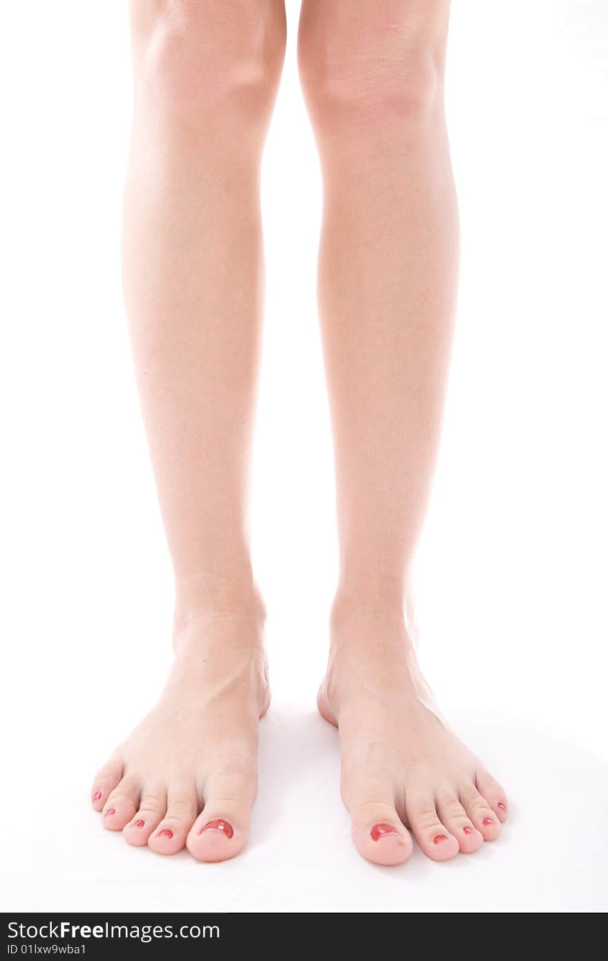 Naked women's feet isolation on a white background. Naked women's feet isolation on a white background.