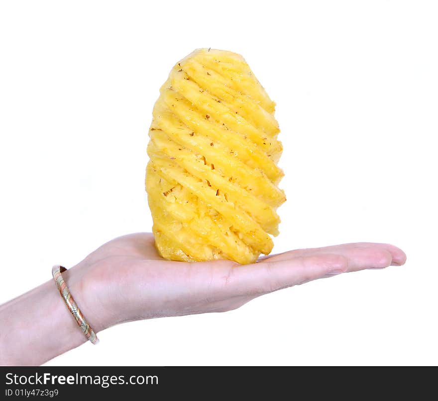 Hand holding a freshly cut pineapple on white background. Hand holding a freshly cut pineapple on white background