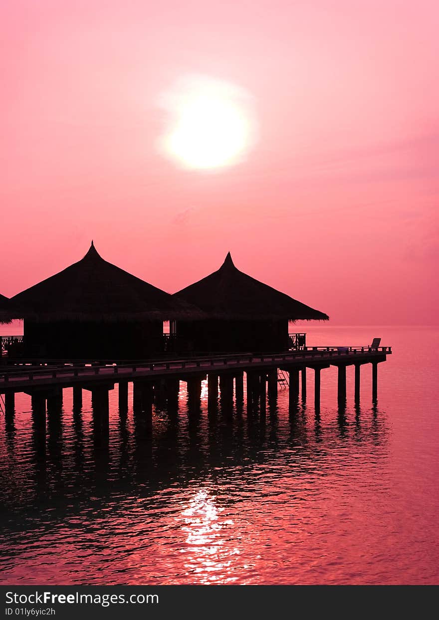 Water bungalows and sunset