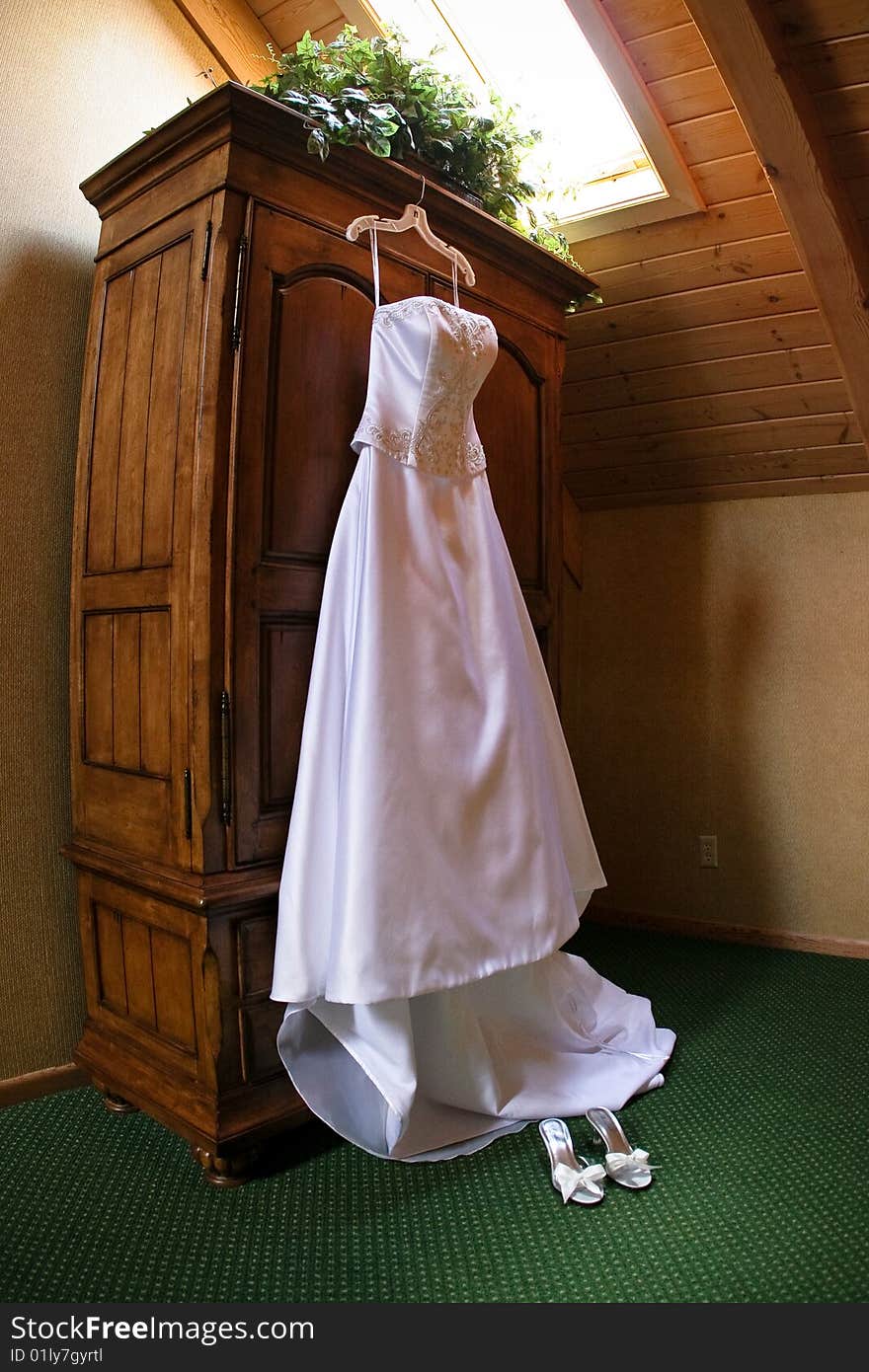 White wedding dress hanging pre wedding. White wedding dress hanging pre wedding