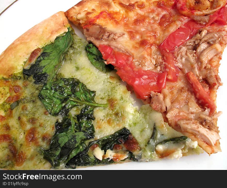 Photo of slices of pizza made from organic ingredients.  On the left is a spinach and ricotta pizza slice.  On the right is a chicken, tomato and balsamic vinegar pizza slice. Photo of slices of pizza made from organic ingredients.  On the left is a spinach and ricotta pizza slice.  On the right is a chicken, tomato and balsamic vinegar pizza slice.