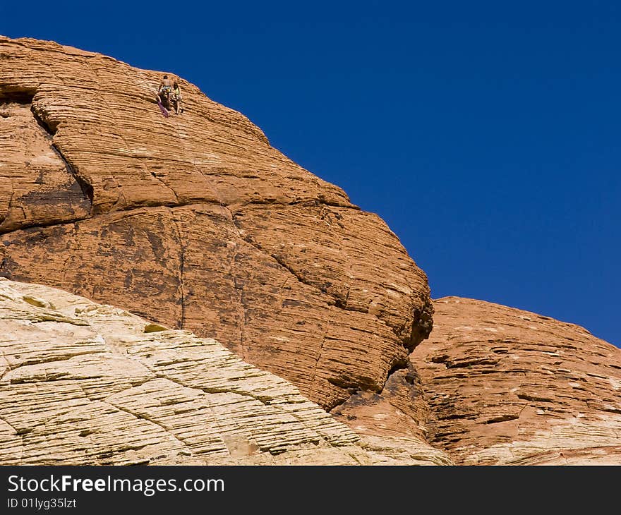 A team of climbers climbing at Red Rock canyon in Nevada.