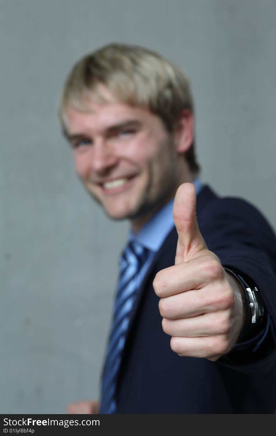 Young man with high thumb