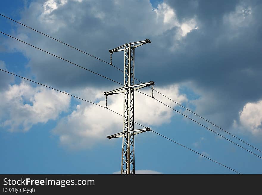 Photo of transmission pole with clouds