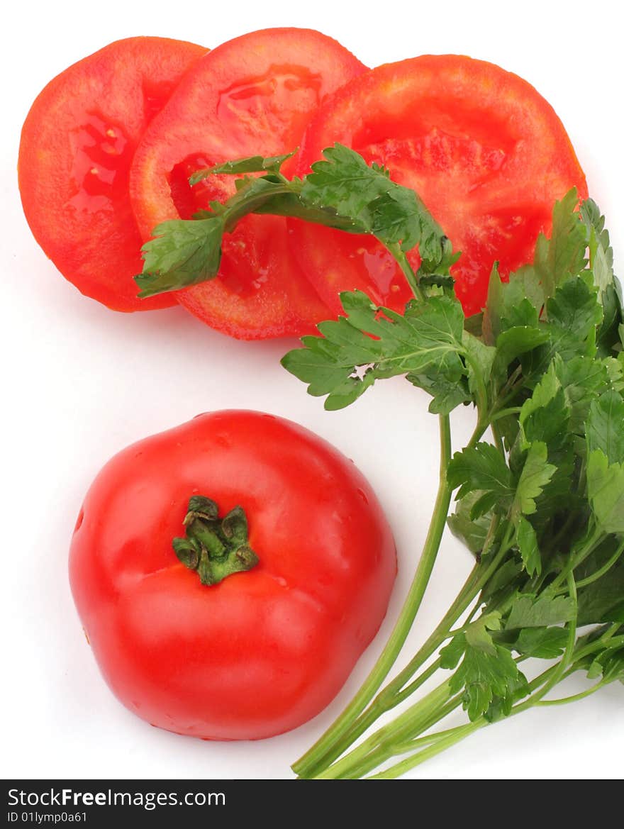 Sliced fresh red tomatoes with green parsley