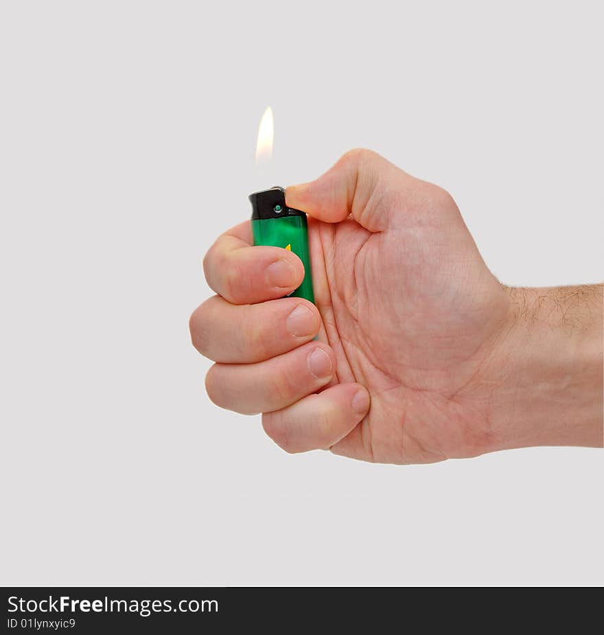 Hand with cigarette lighter isolated on white background