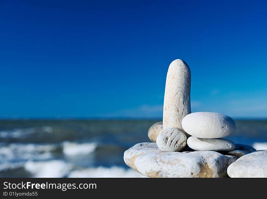 The group of white cobble-stones on the sea shore. The group of white cobble-stones on the sea shore