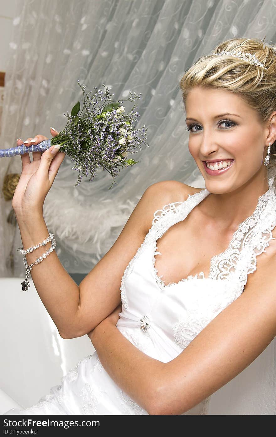 Beautiful Blond bride wearing diamond jewelery and tiara. Beautiful Blond bride wearing diamond jewelery and tiara