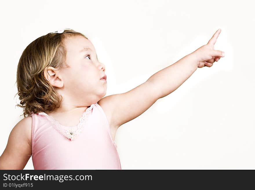 Little girl with short hair wearing a pink ballet outfit