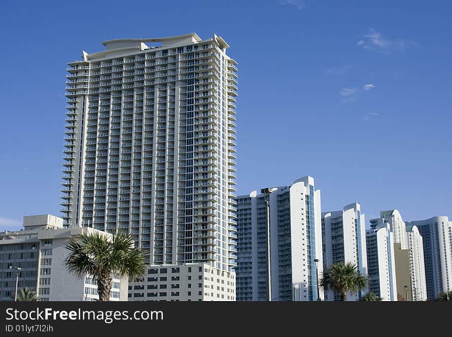 Several hotel buildings on the blue sky background. Several hotel buildings on the blue sky background