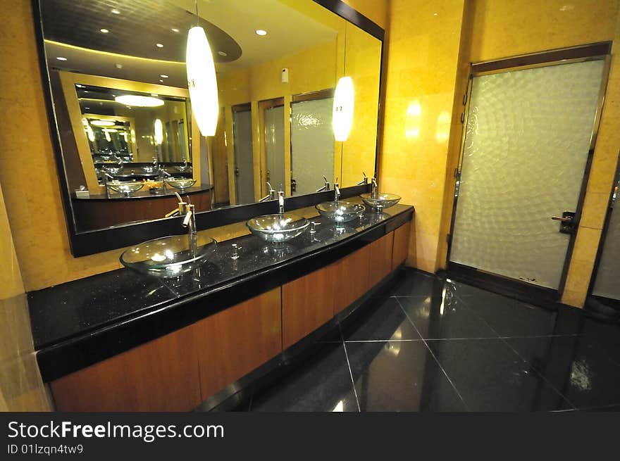 The interior of a luxurious and nicely decorated restroom.