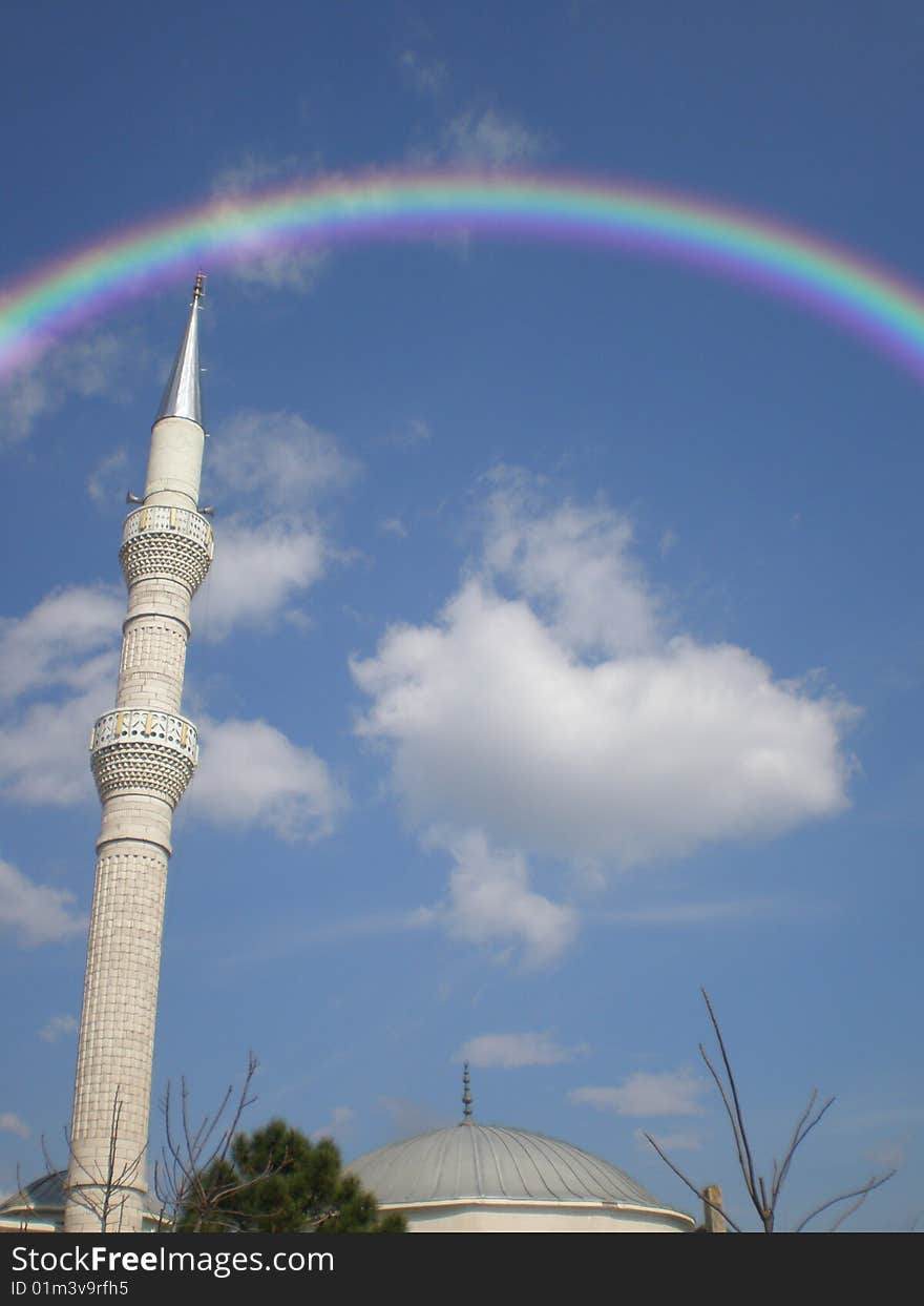 Mosque on a sky background with a rainbow