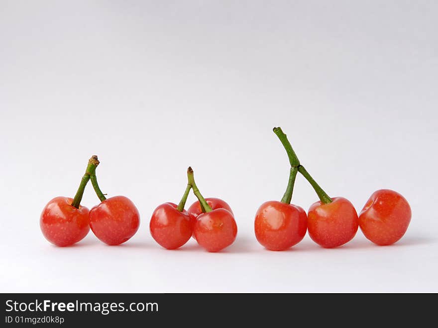 Cherries are in a line,and the branchs look like chinese character.