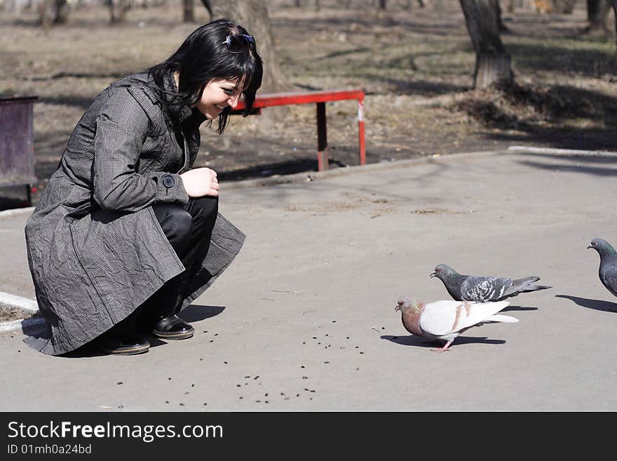 Girl feeding birds