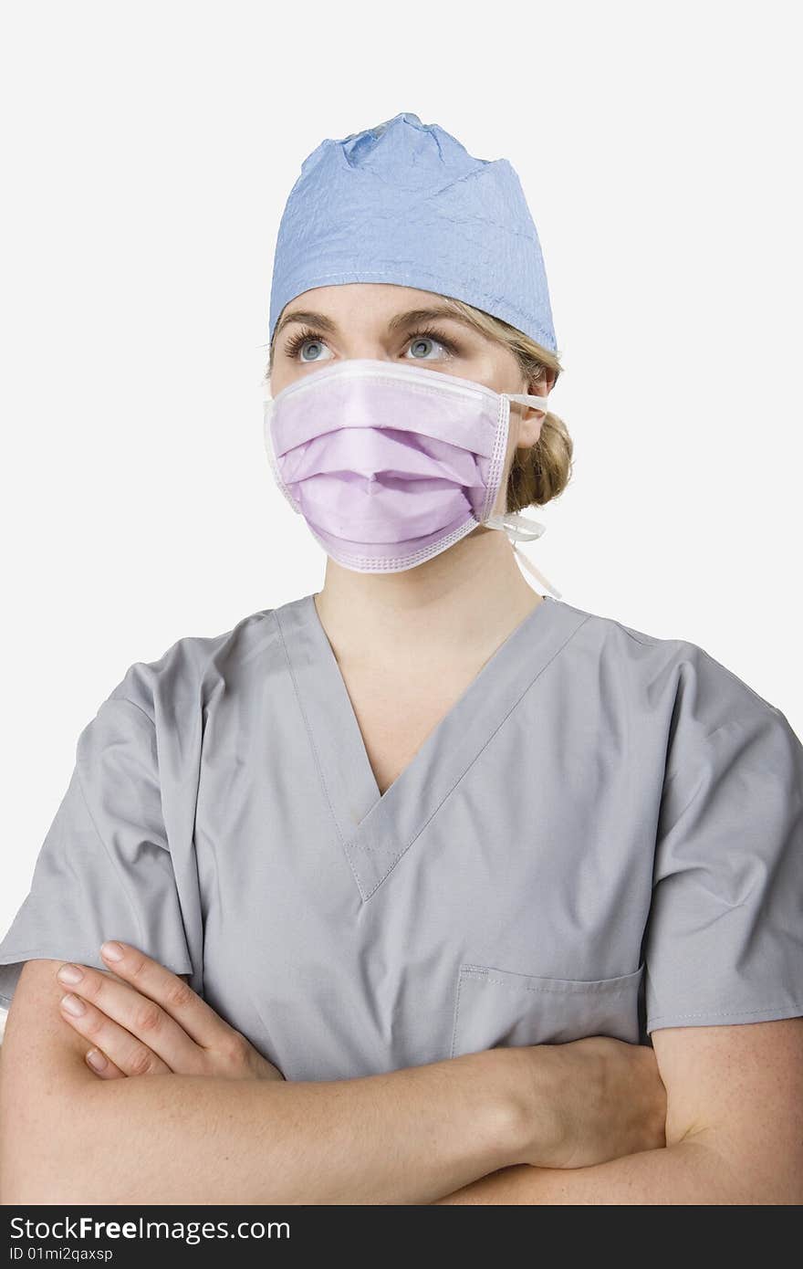 Female surgeon dressed in scrubs prepared for work. Female surgeon dressed in scrubs prepared for work