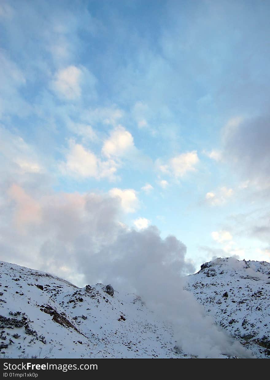 The huge amount of smoke comes out from the volcano at the Hokkaido Japan. The huge amount of smoke comes out from the volcano at the Hokkaido Japan