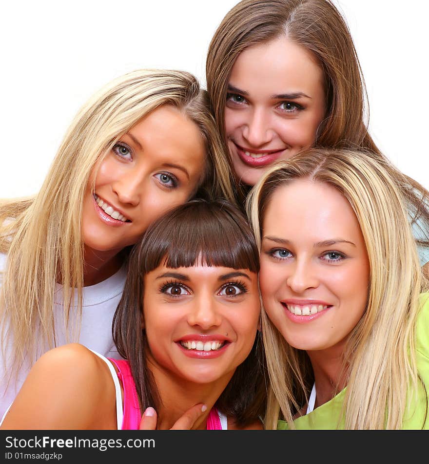 Four beautiful happy young women with a smile in bright multi-coloured clothes. Four beautiful happy young women with a smile in bright multi-coloured clothes