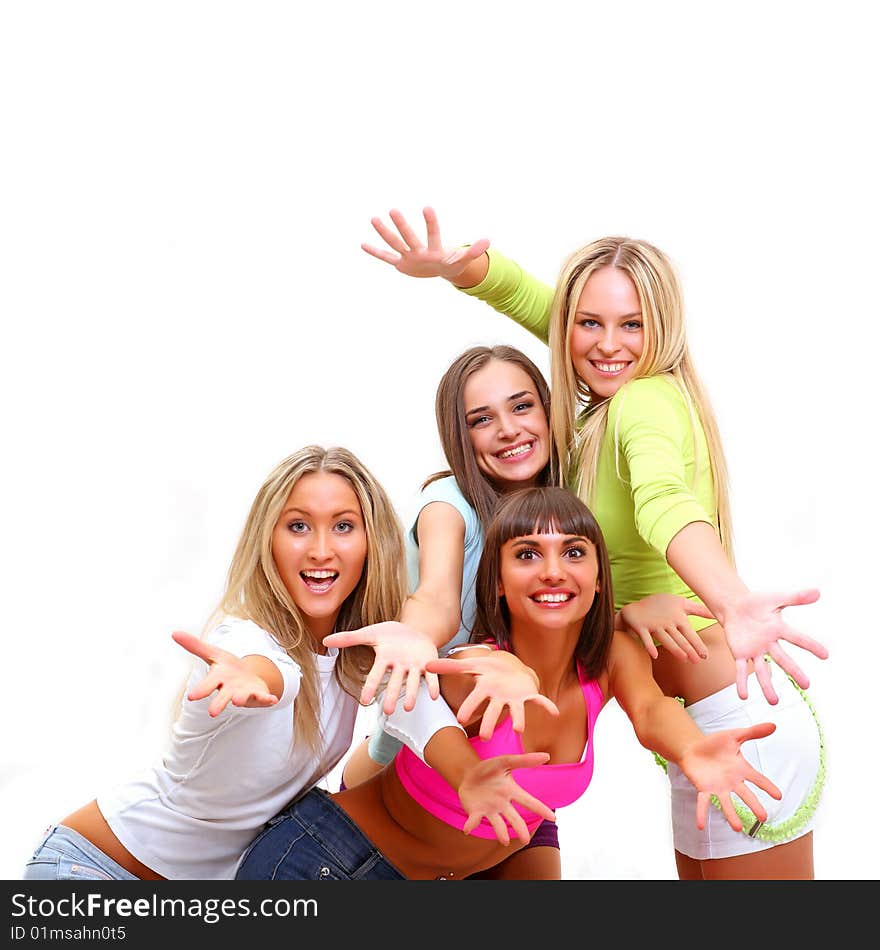 Four beautiful happy young women with a smile in bright multi-coloured clothes. Four beautiful happy young women with a smile in bright multi-coloured clothes