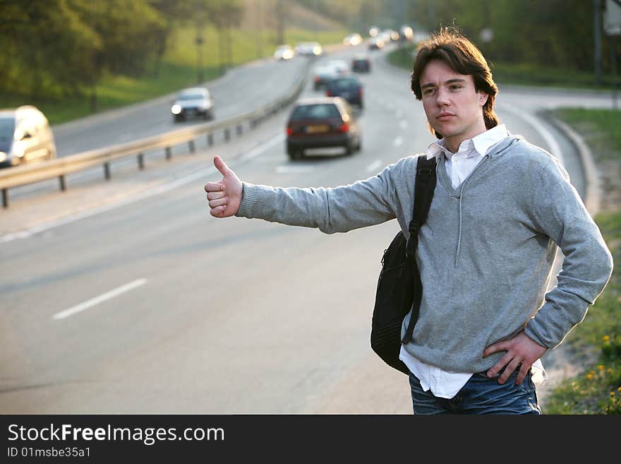 Student hitchhiking - need a drive. Student hitchhiking - need a drive