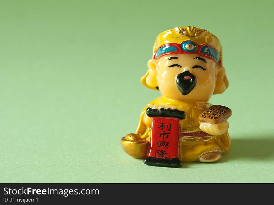 God of Wealth, in chinese it mean can bring good lock with lot of money isolate with light green color