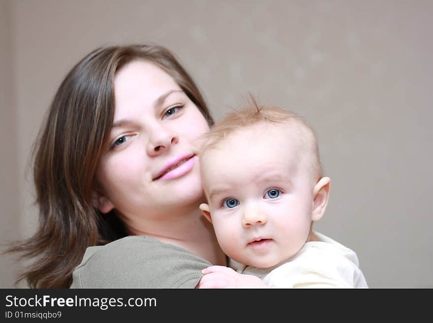 Happy Mother With A Young Baby